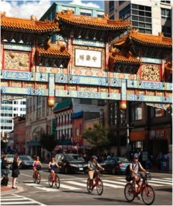 People cycling through Chinatown