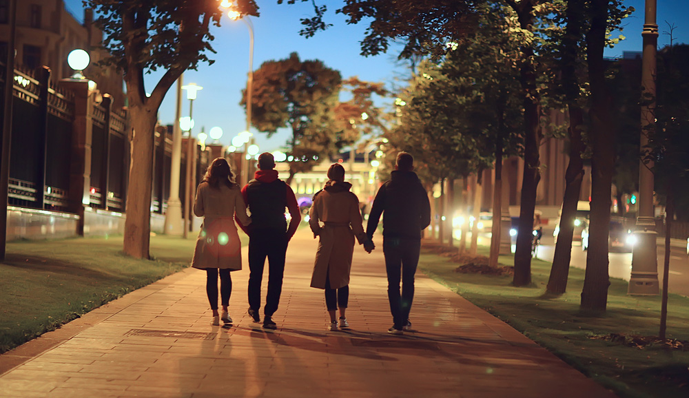 Group of people walking at night
